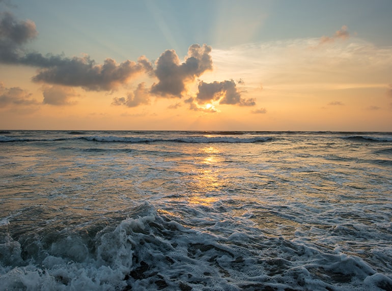Ocean waves at sunset