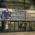 The exterior of a building with a sign that says Welcome to The Evolution of Psychotherapy