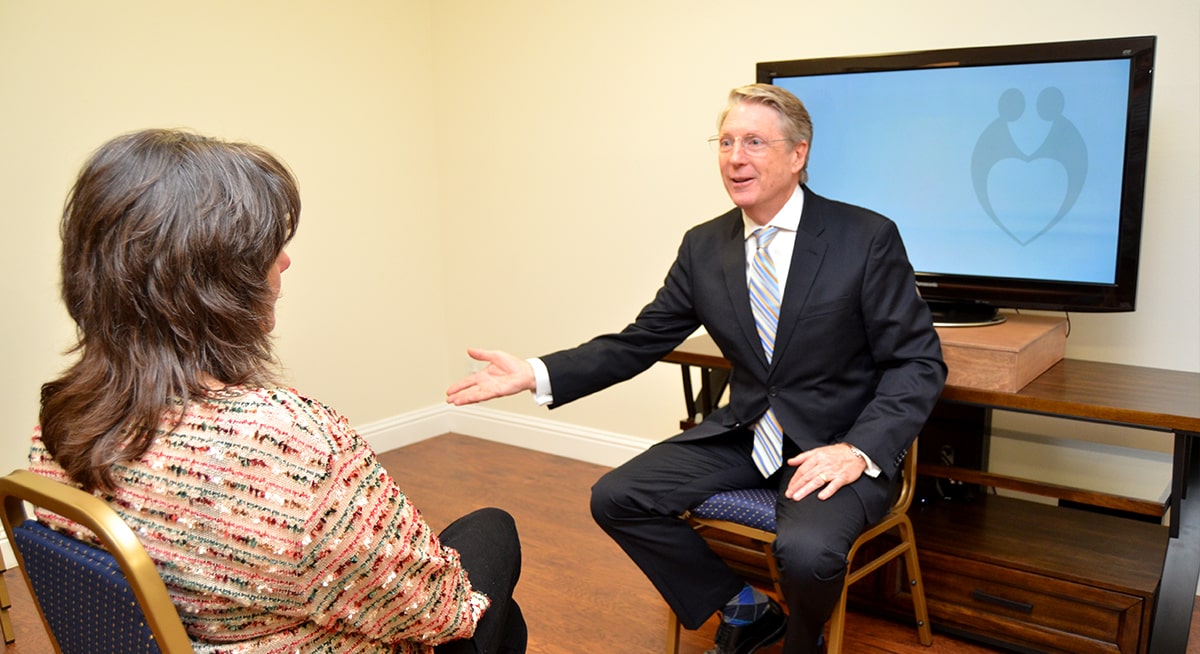 Stephen Diggs PhD sits with a professional therapist for a consultation.